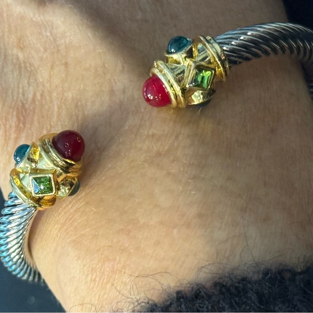 Gorgeous colorful open work stainless bangle with red, blue & green stones.